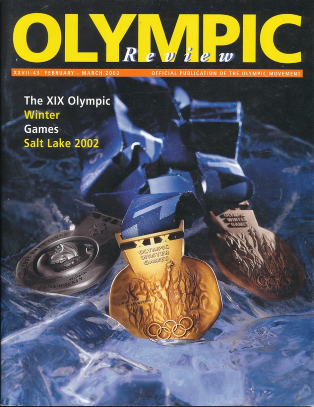 Ein Buch mit dem Titel "Olympische Übersichtszeitschrift" und mehreren Medaillen und fetter Schrift auf dem Cover.