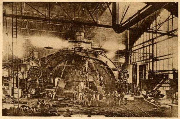 Ein Schwarz-Weiß-Foto einer Fabrikhalle mit Arbeitern an einer großen Maschine, umgeben von Leitern und Stangen, mit dem Text "Cadillac Steel Works" unten.
